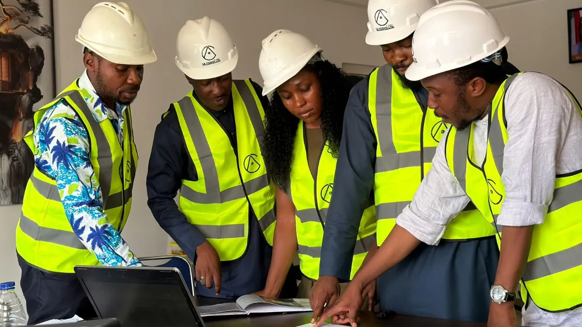 Construction safety team reviewing project documents and responsibilities.